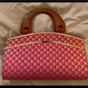 Wooden handle clutch with detailed woven snap